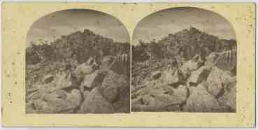 Three men sitting on boulders, kunanyi/Mt Wellington